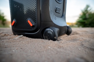 a close up of a black and orange suitcase