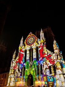 a large cathedral lit up with colorful lights