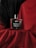 A bottle of Beardo Whisky Smoke eau de parfum is placed on red fabric. The background is a combination of black and red drapery, creating a dramatic and luxurious setting. The bottle has a sleek, rectangular design with a dark cap.