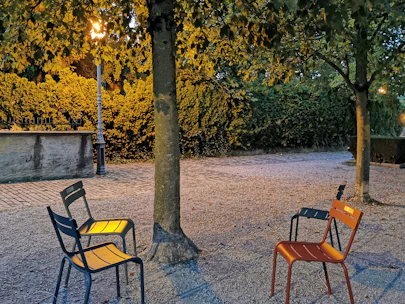 Empty chairs arranged solemnly at the Trocadéro, symbolizing unity and remembrance.