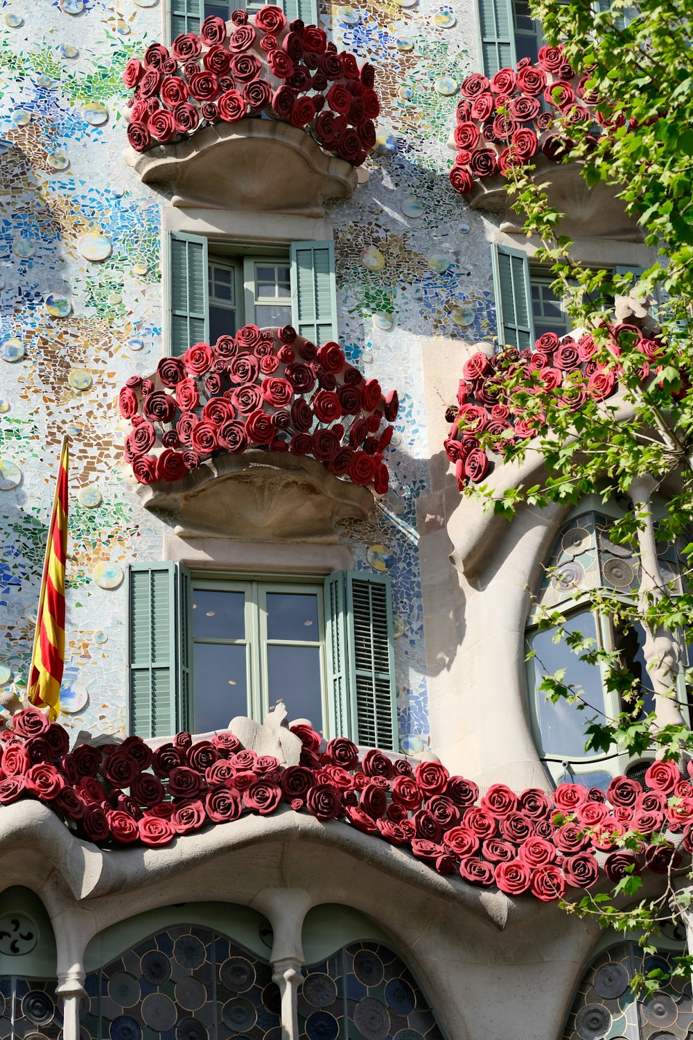 a building that has a bunch of flowers on it