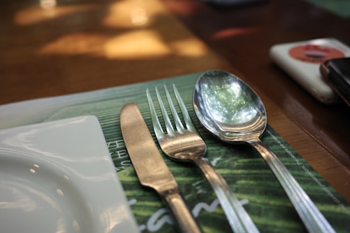 Close-up of plant-based plates and utensils.