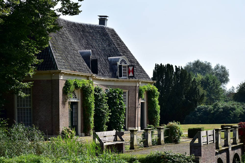 a brick building with ivy growing all over it