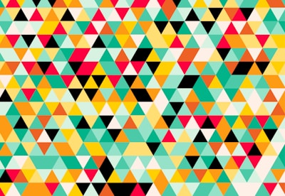 A lively game scene with various geometric shapes forming a fun mosaic pattern.