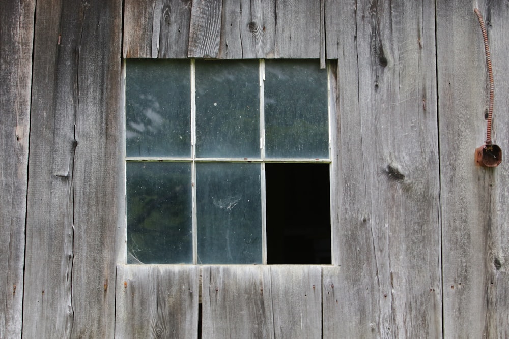 a window in the side of a wooden building