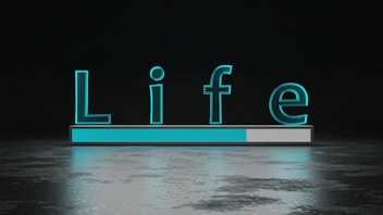 The word 'Life' is displayed in large, glowing teal letters above a horizontal progress bar that is partially filled. The background is dark with a reflective surface below the text and bar, creating a sense of depth and modernity.