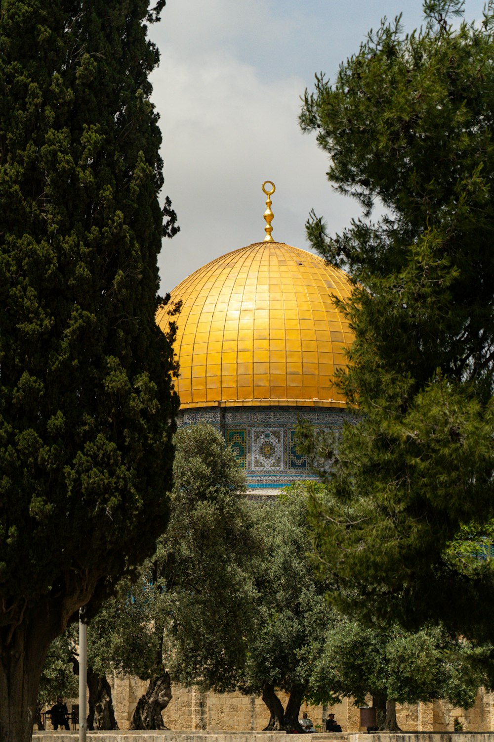 the dome of a building with a golden top