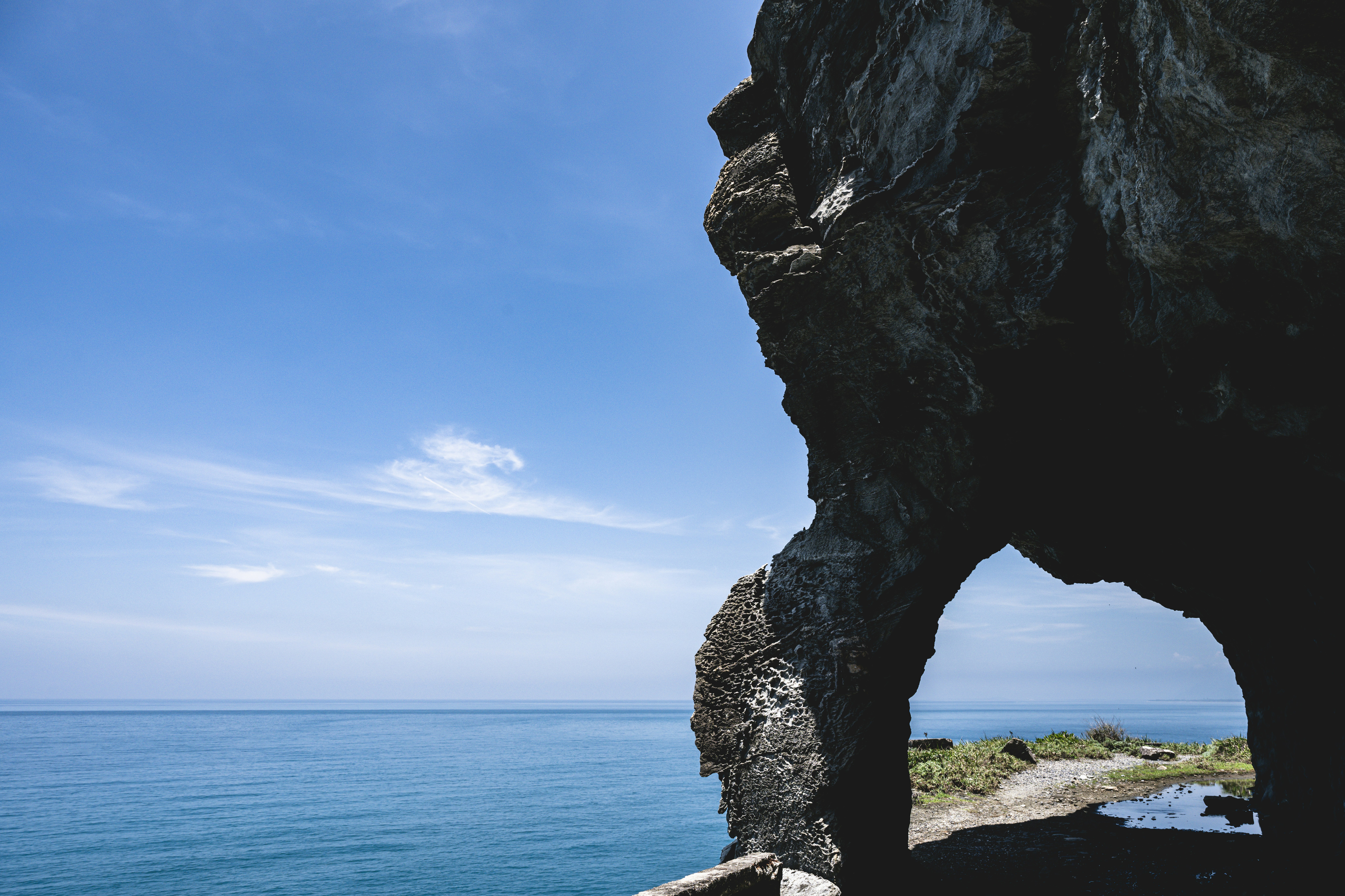a large rock formation near a body of water