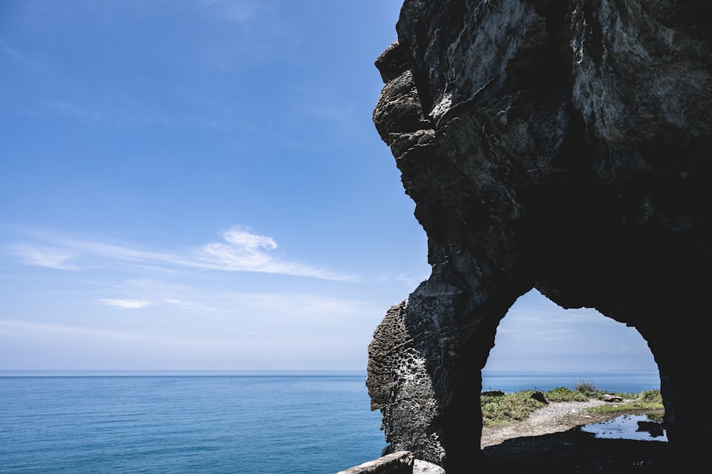 a large rock formation near a body of water