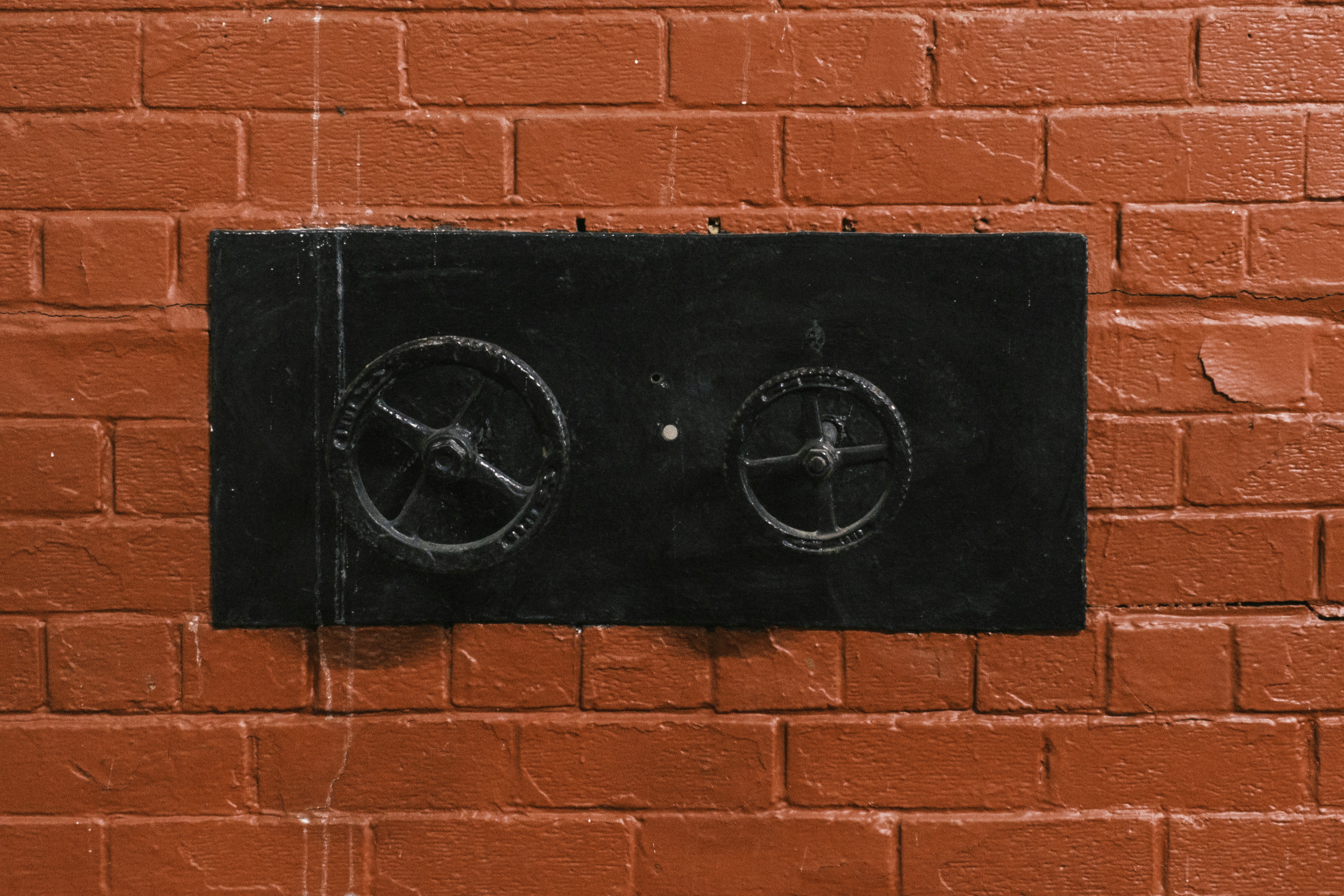 Property exterior with brick wall