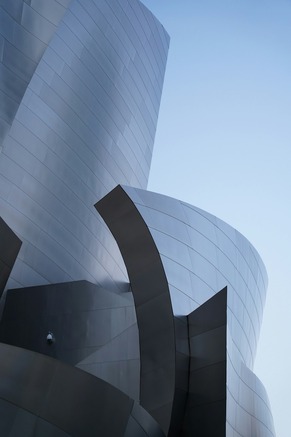 a close up of a building with a sky in the background