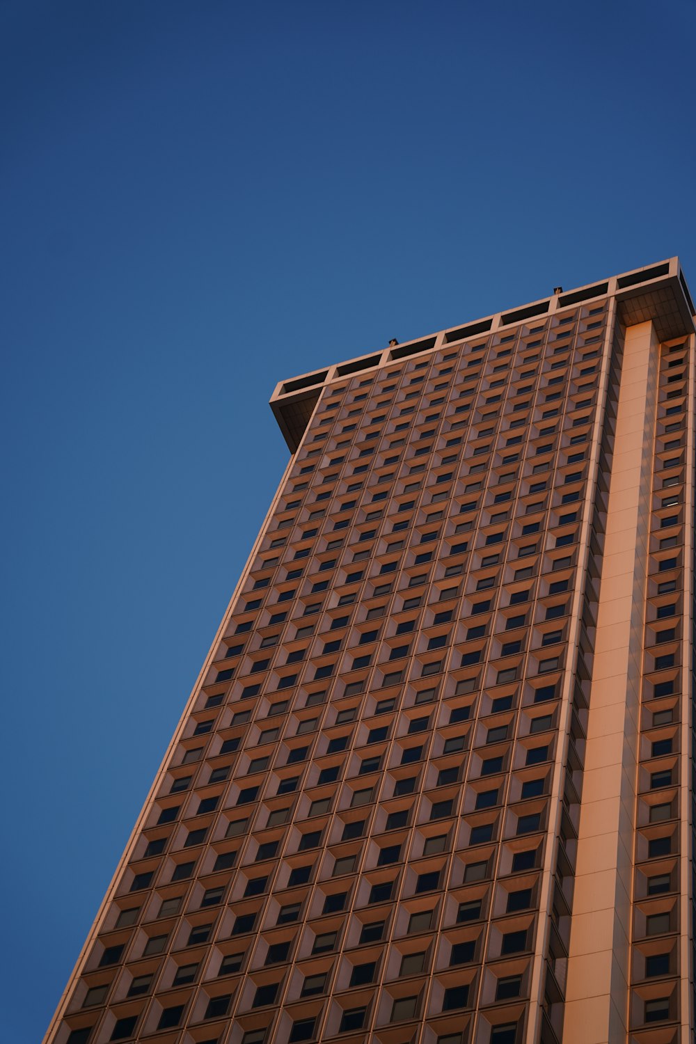 a tall building with a sky background