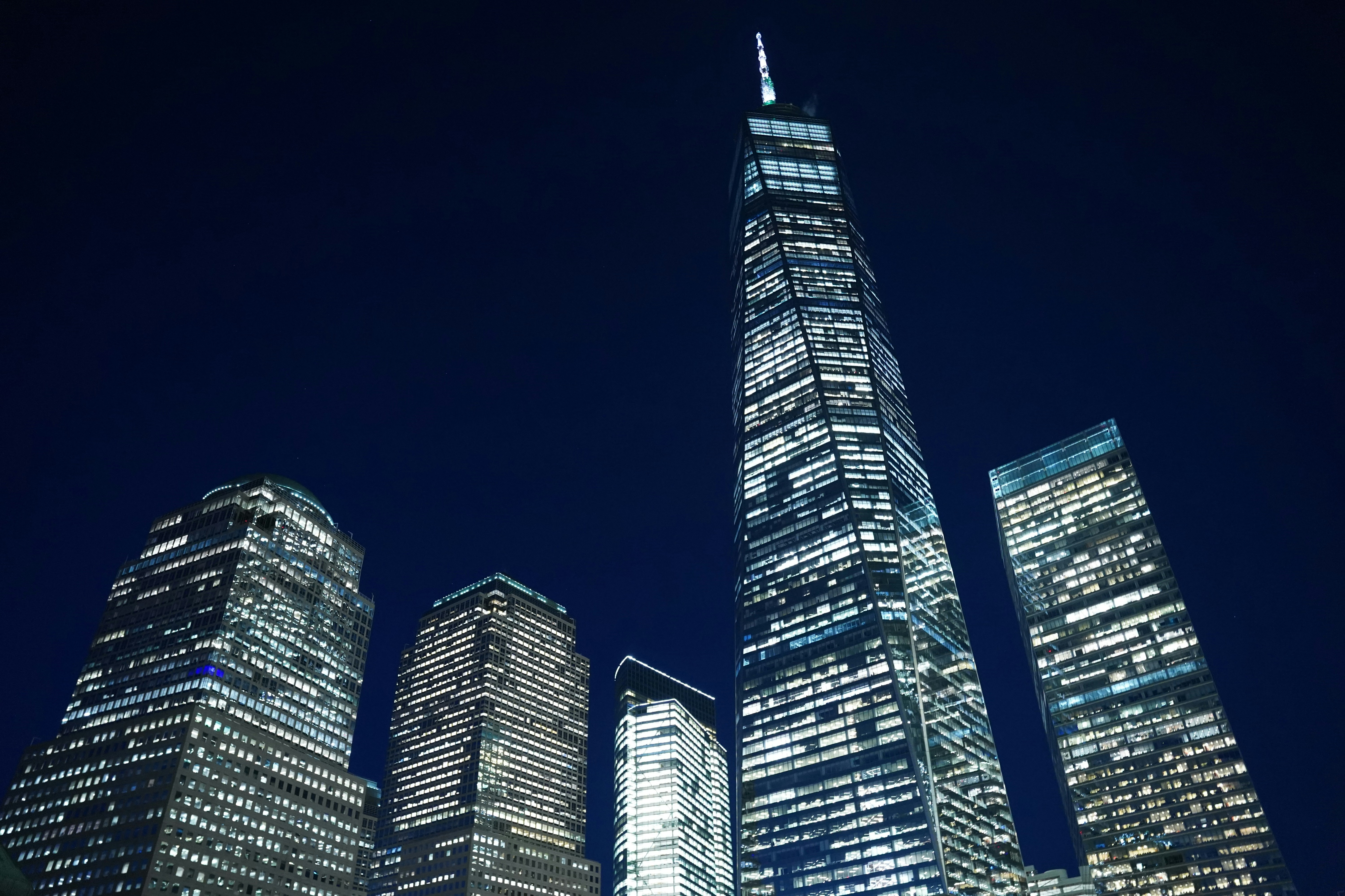 a very tall building in a city at night