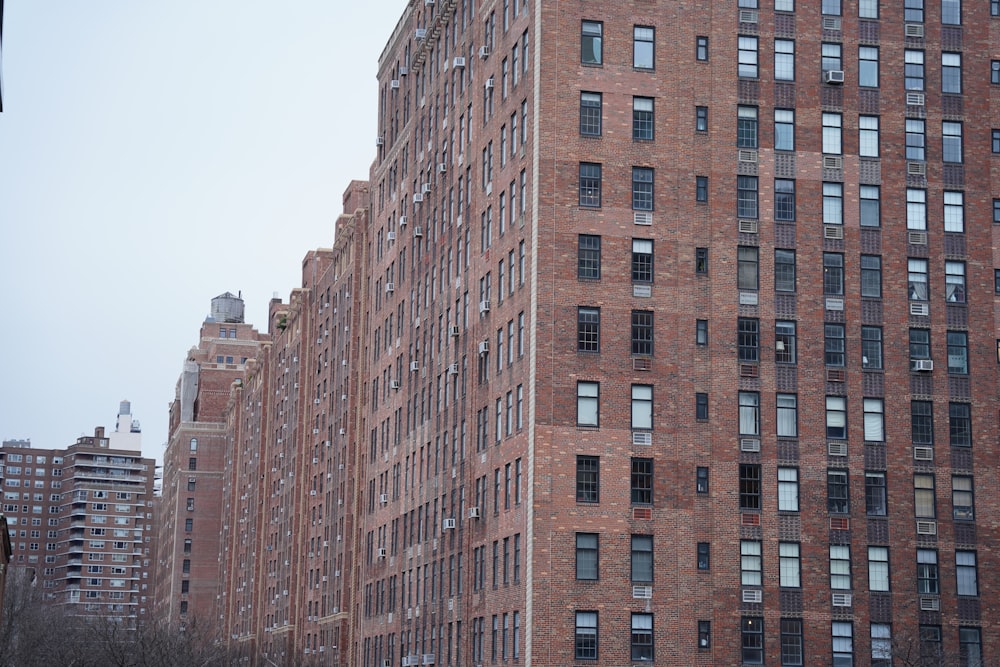 a very tall brick building with lots of windows