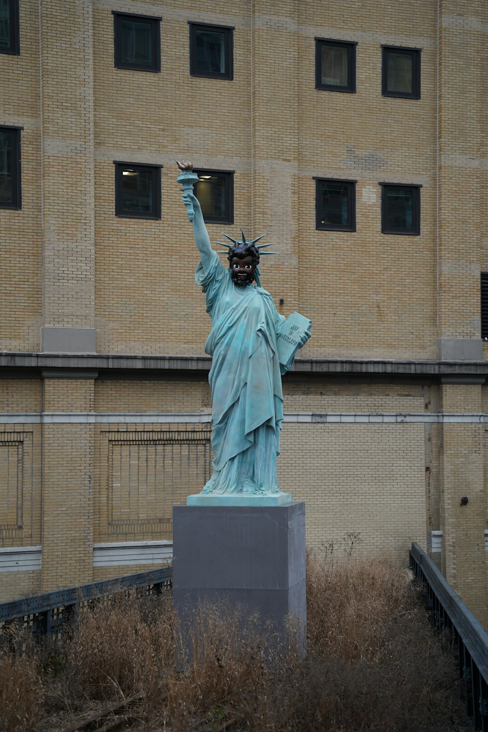 a statue of liberty in front of a building