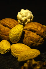 Close-up of premium organic nuts and seeds beautifully arranged on natural wooden surface.