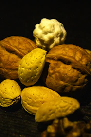 A vibrant arrangement of cashews and pistachios in natural light highlighting their textures.