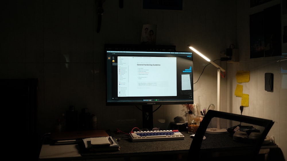 a computer monitor sitting on top of a desk