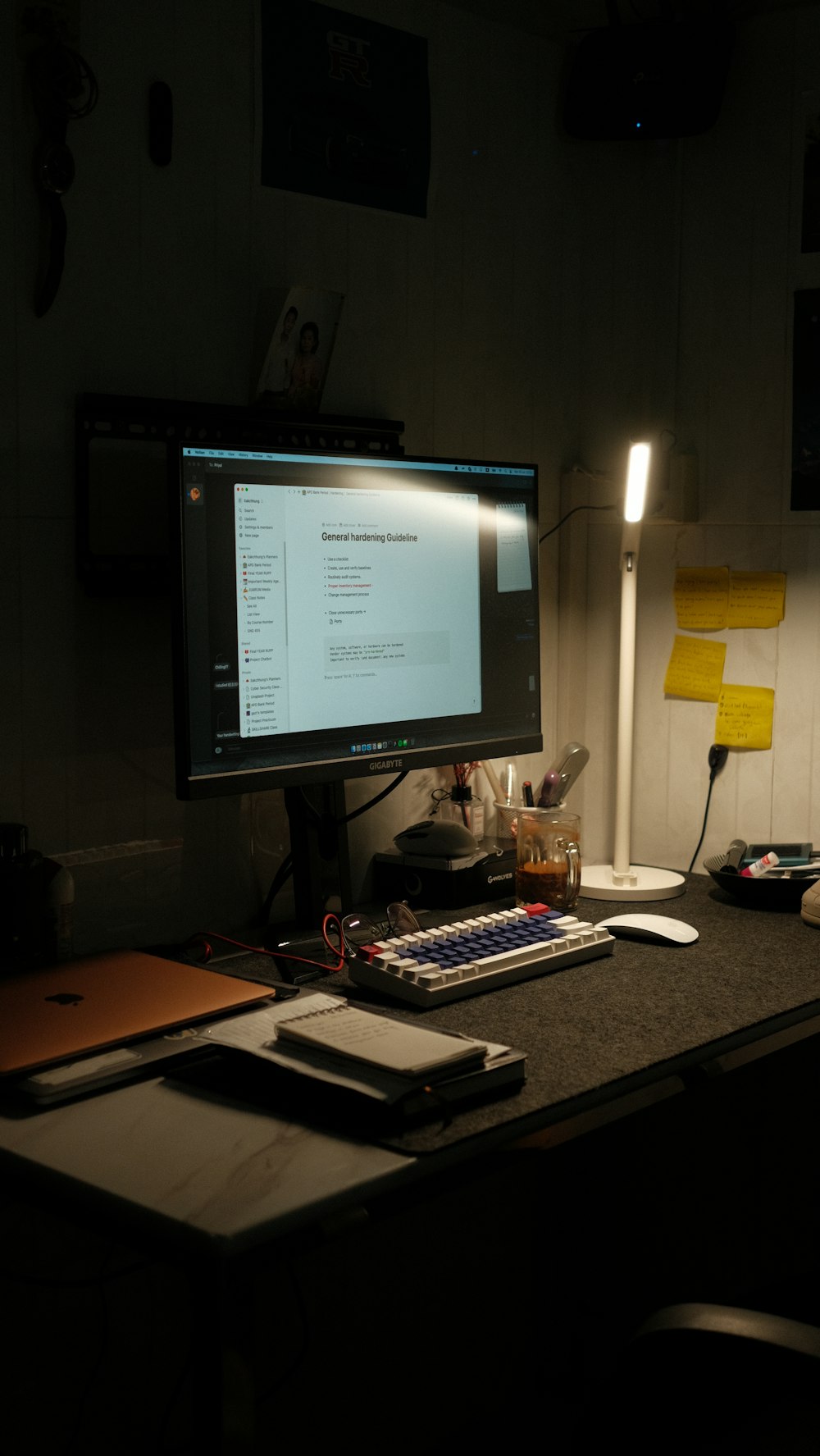 a computer monitor sitting on top of a desk