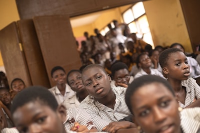 a group of young people sitting next to each other