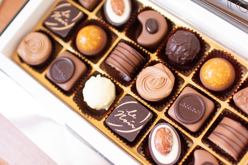 a box of assorted chocolates sitting on a table