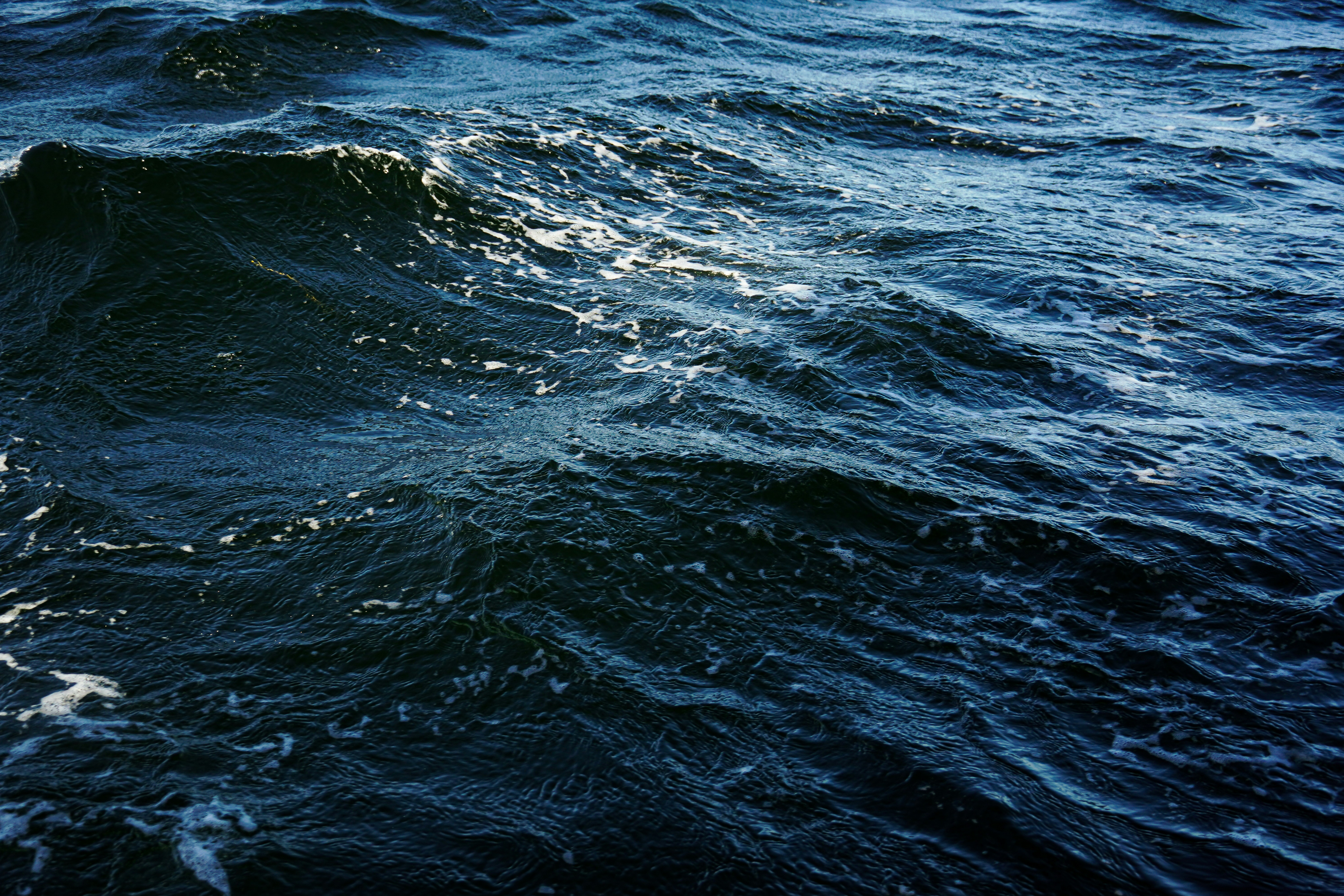 a large body of water with waves in it