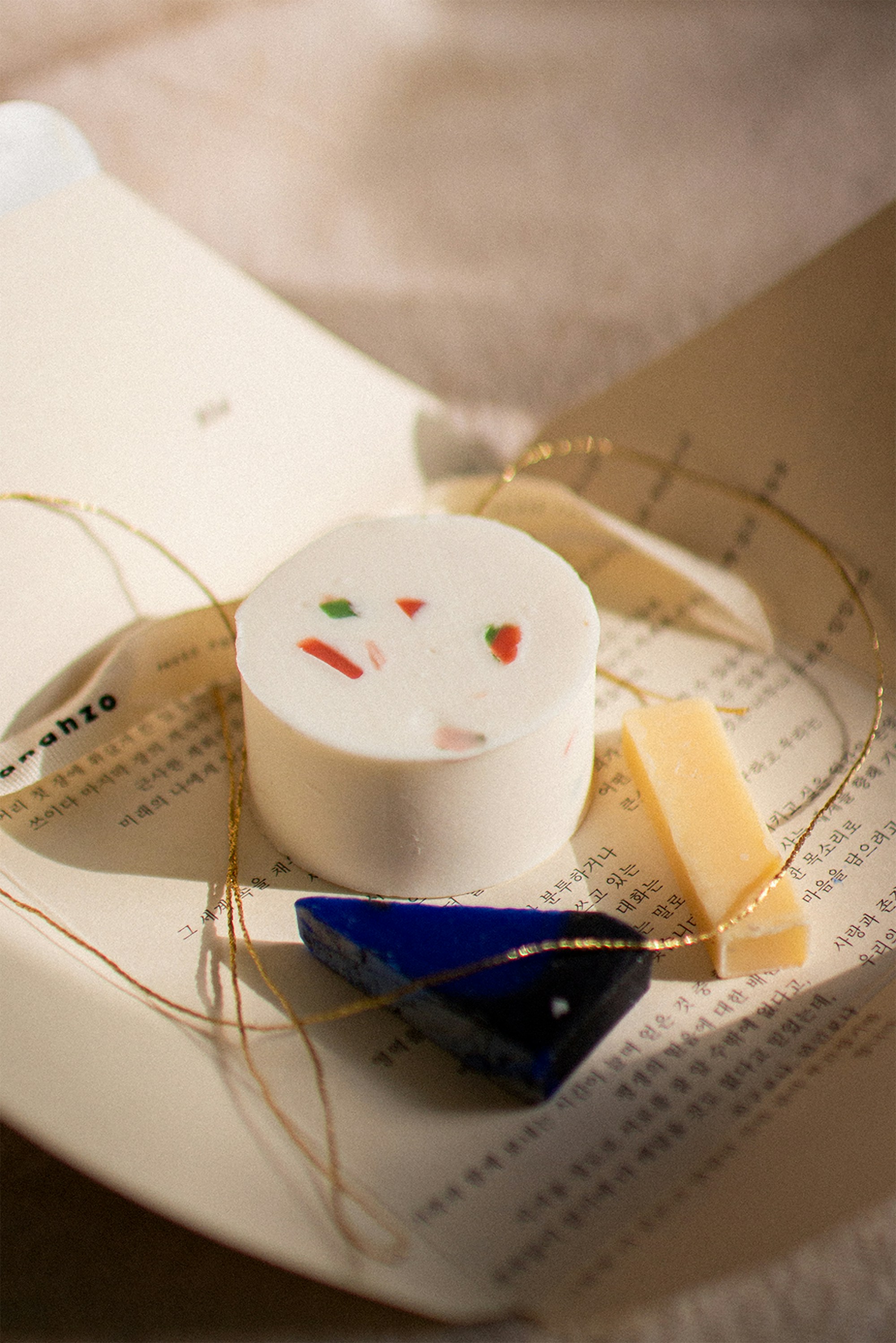a piece of cheese sitting on top of a book