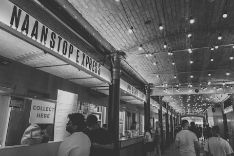 A bustling food court showcasing Mumbai Express's food stall.