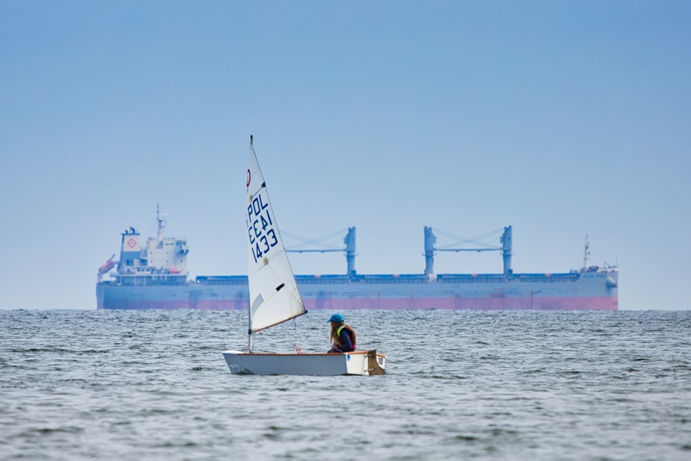 a person on a small boat in the water