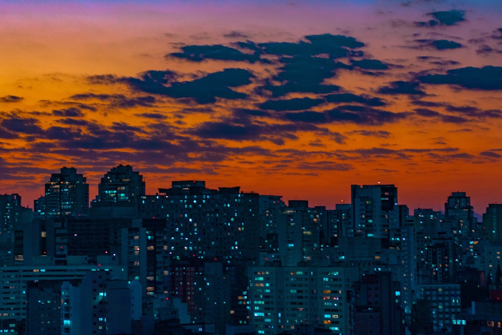 a view of a city skyline at sunset