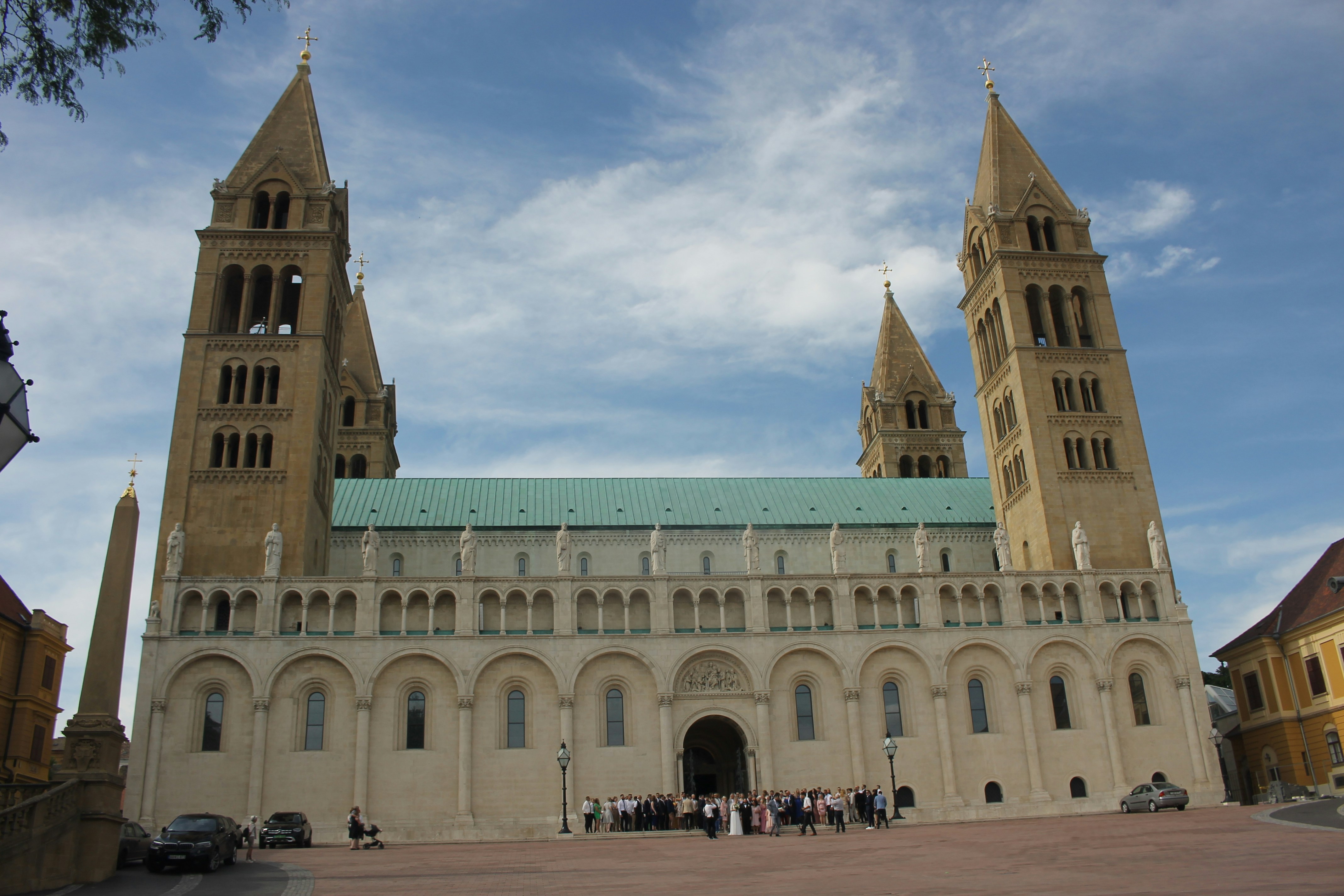 a large cathedral with two towers and a green roof