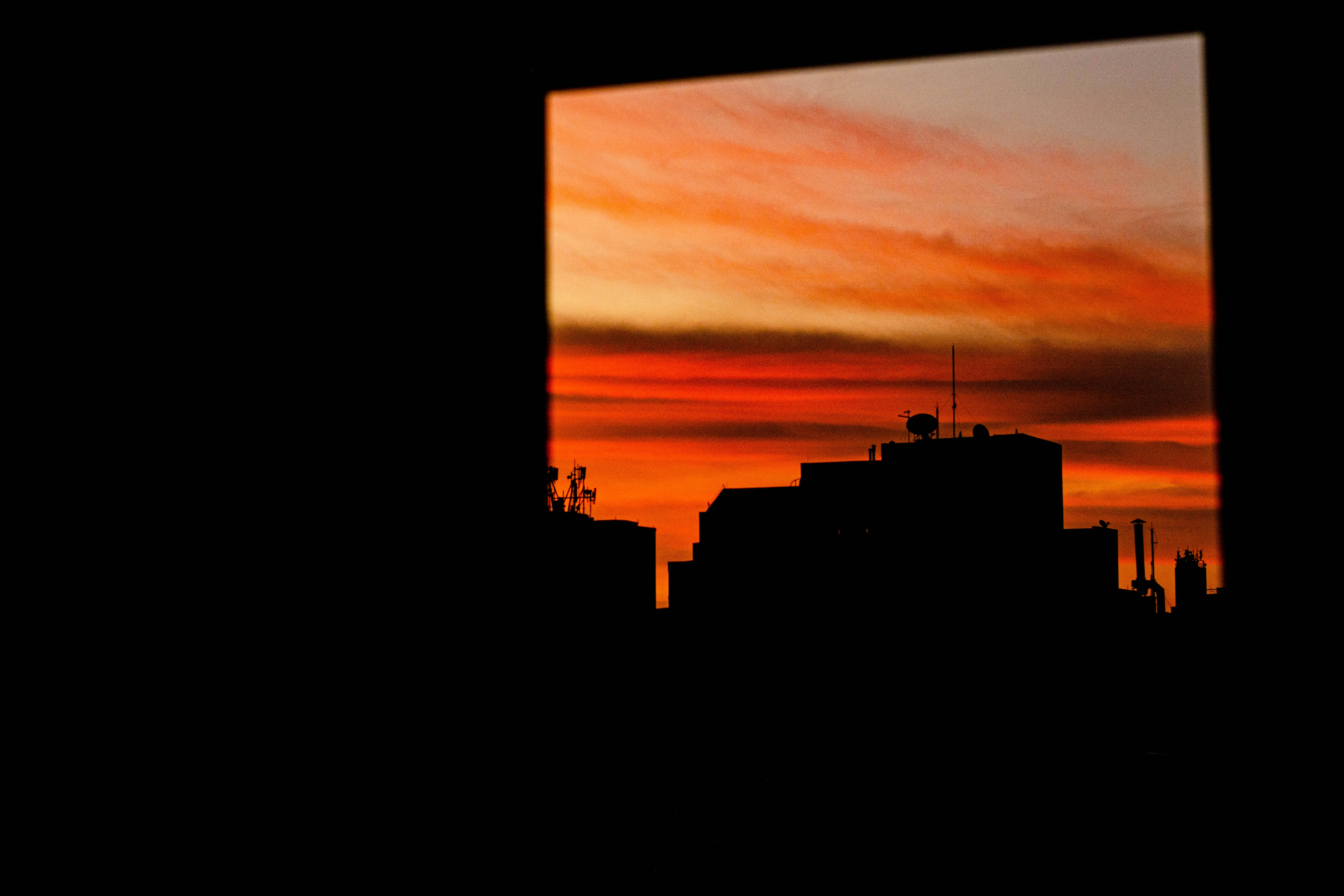 sunset view from apartment living room - apartments with city views