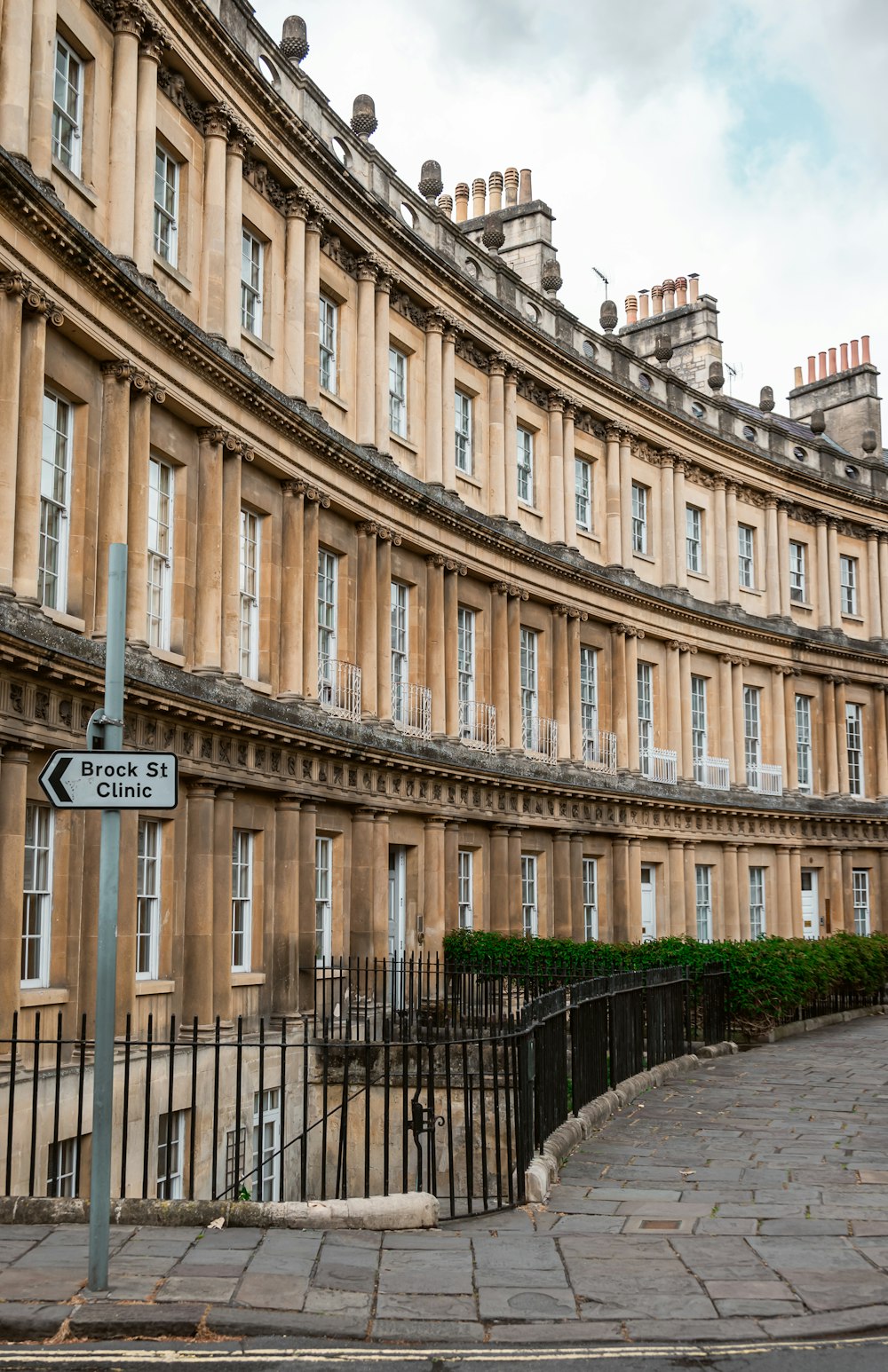 a street sign in front of a row of buildings