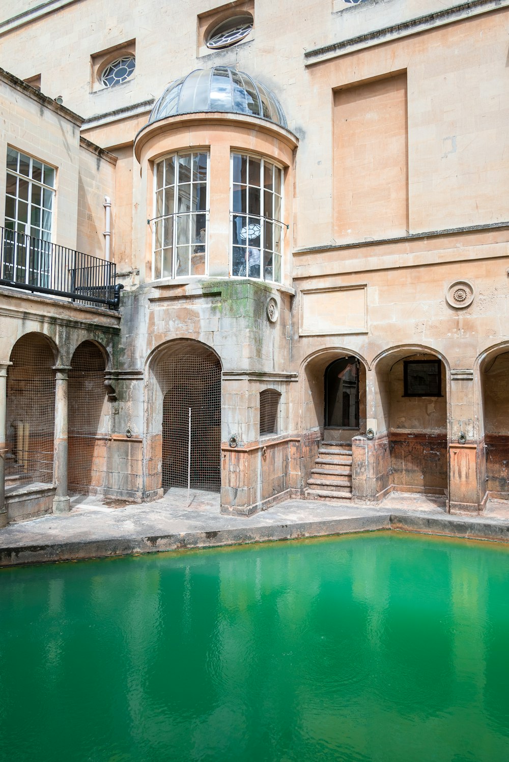 a building with a pool of water in front of it