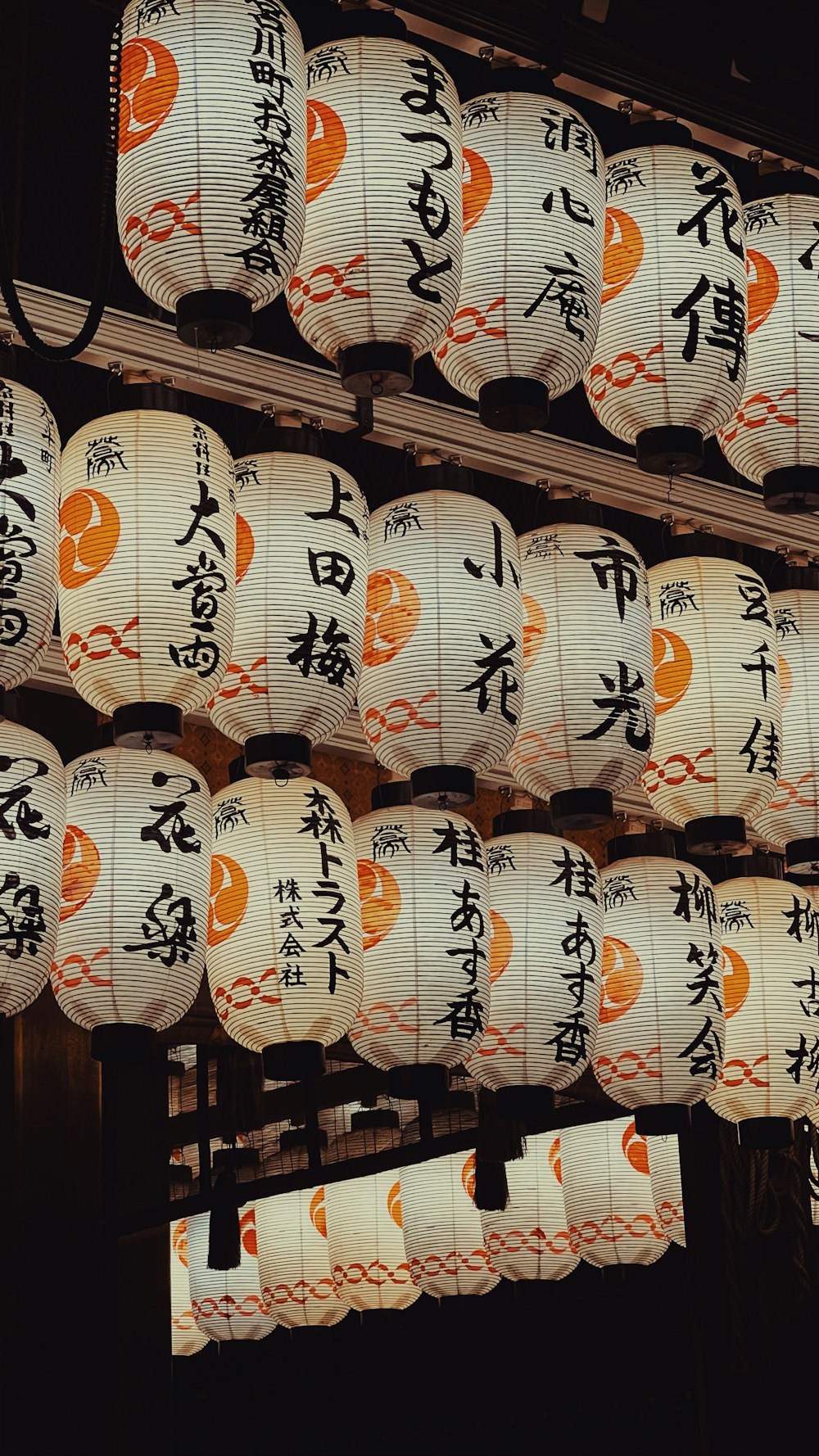 a bunch of paper lanterns with asian writing on them