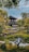A serene Japanese garden with cherry blossoms and a tranquil pond.