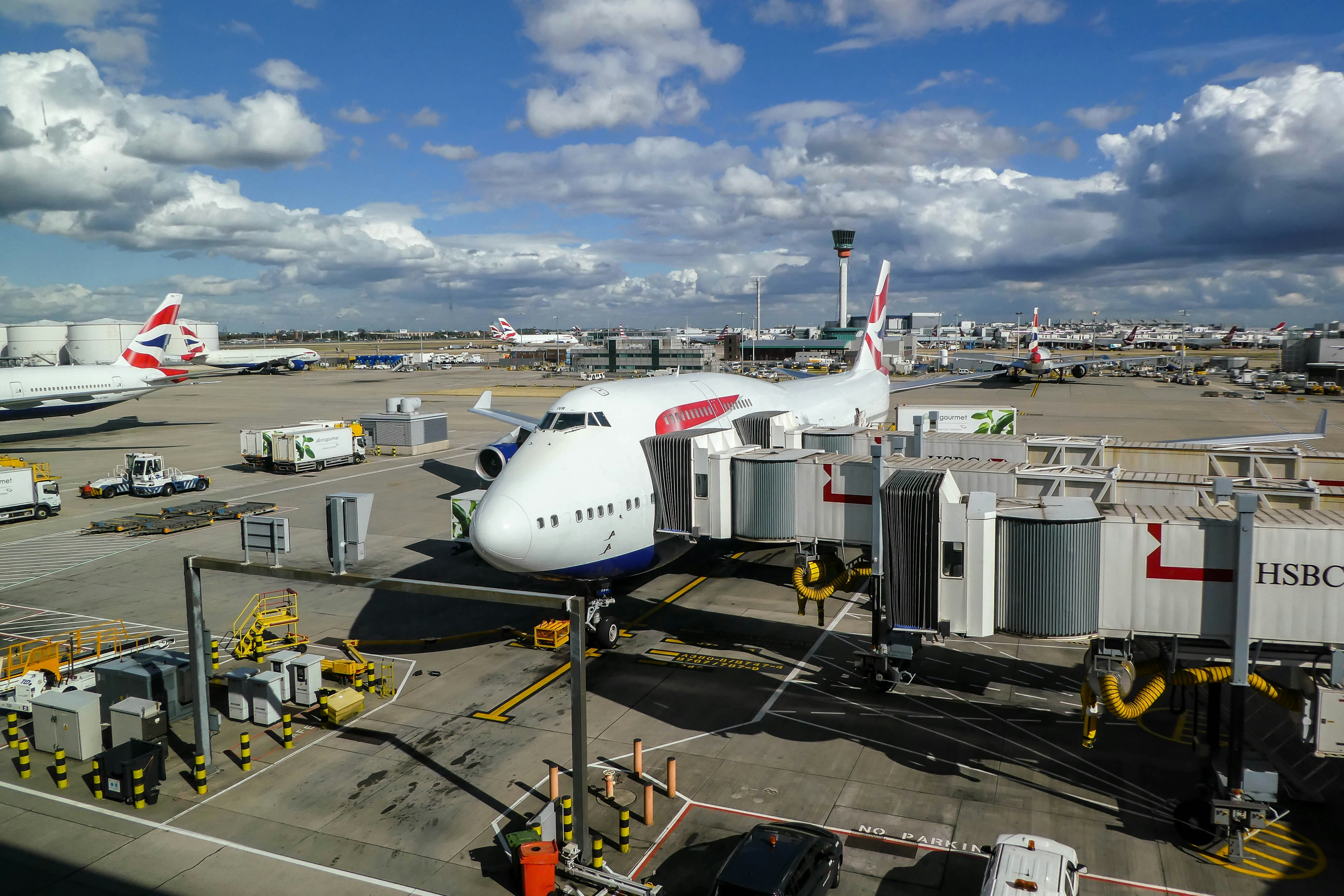 a large jetliner sitting on top of an airport tarmac, British Airways Boeing 747 ready for boarding
