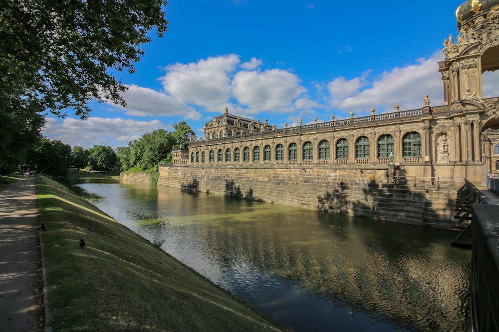 a large building sitting next to a river