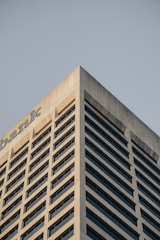 a tall building with a sky in the background
