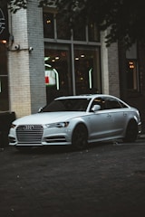 A sleek sedan parked in an urban environment.