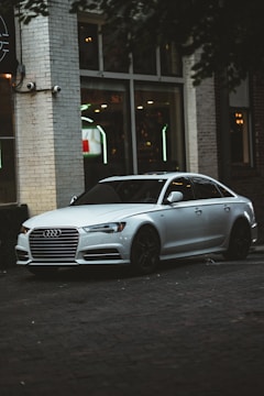A sleek sedan parked in an urban environment.