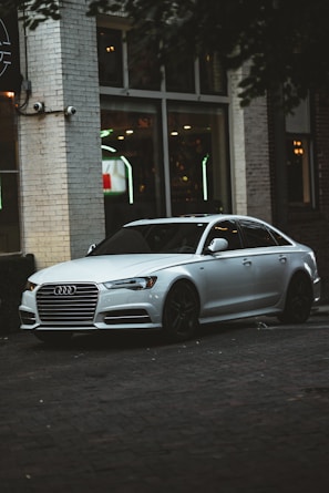 A sleek modern sedan parked in an urban setting.