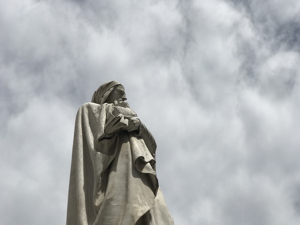 a statue of a man with a robe on