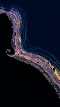 a close up of a cell phone with a black background