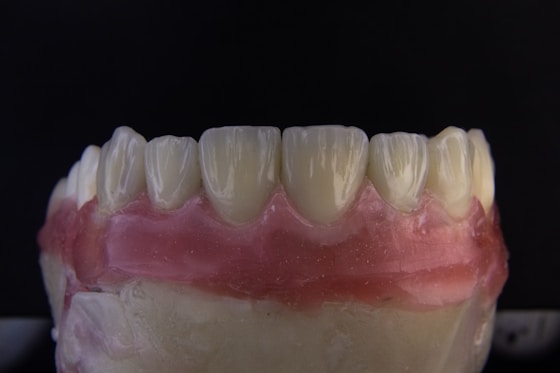 a close up of a tooth with gumpaste on it