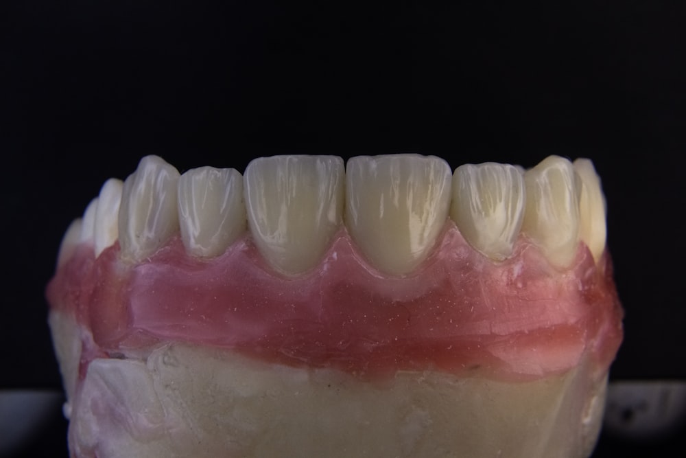 a close up of a tooth with gumpaste on it