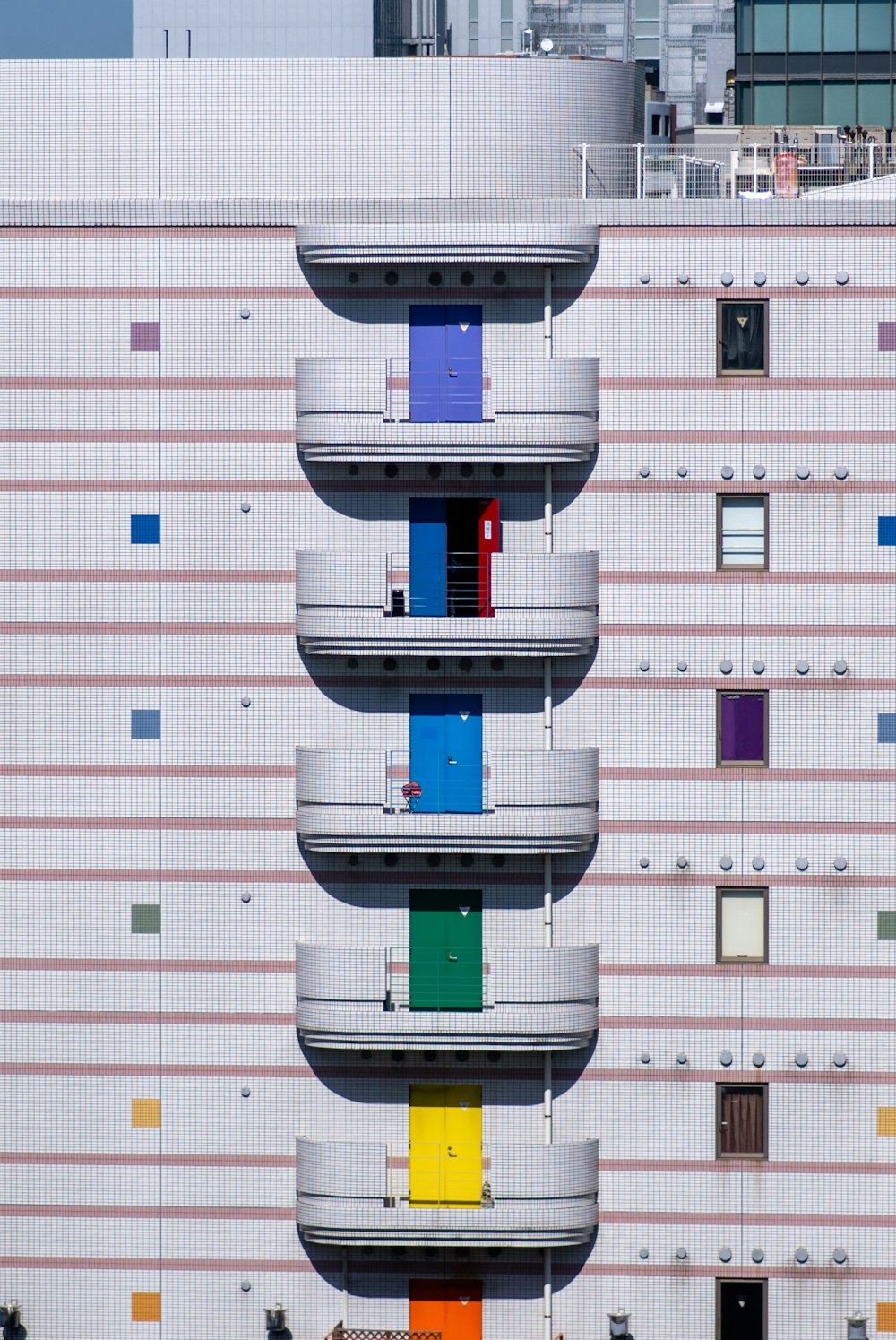 a multicolored building with balconies and balconies