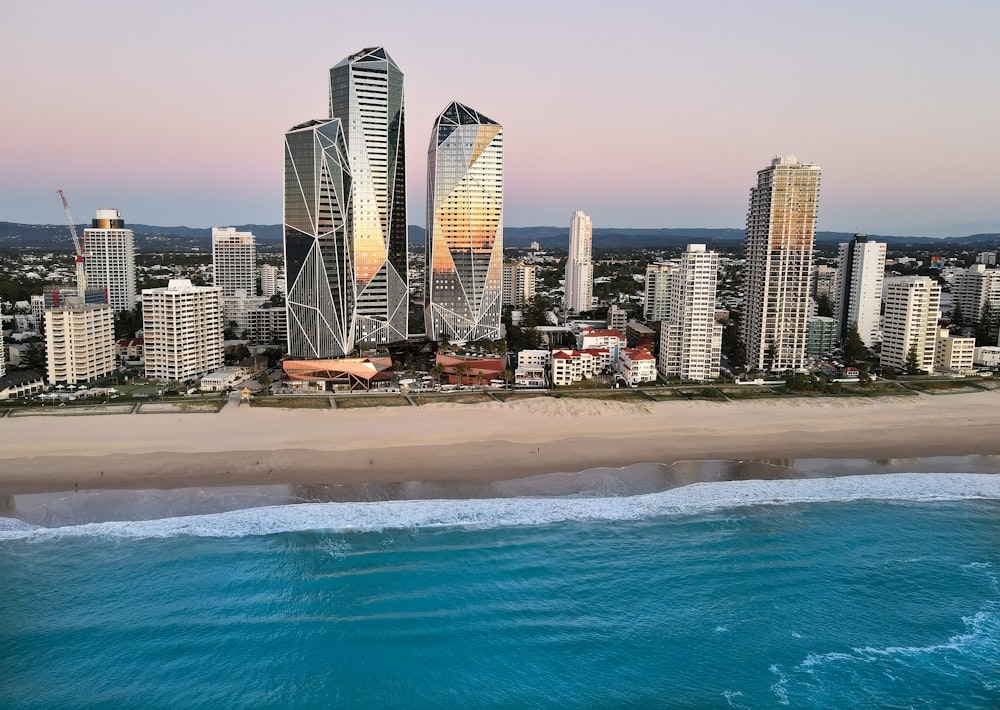 an aerial view of a city next to the ocean