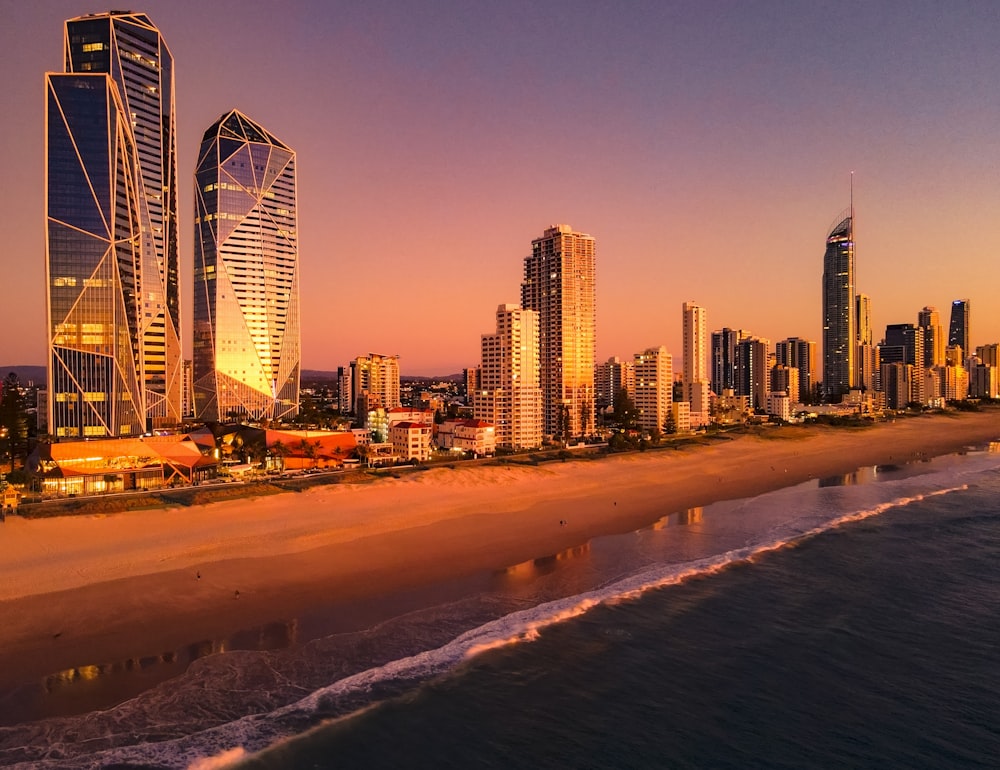 a view of a beach with a city in the background