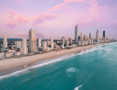 an aerial view of a city and the ocean